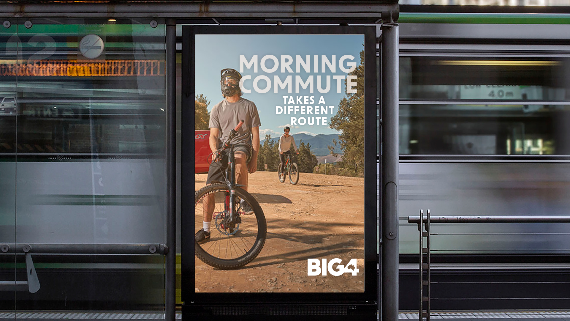 Bus stop poster featuring young couple enjoying drinks outdoors surrounded by lights, with the tagline 'Not Your average Friday Night Drinks'. Part of Big 4's 'Experience More' campaign by Bellwether Agency, 2022