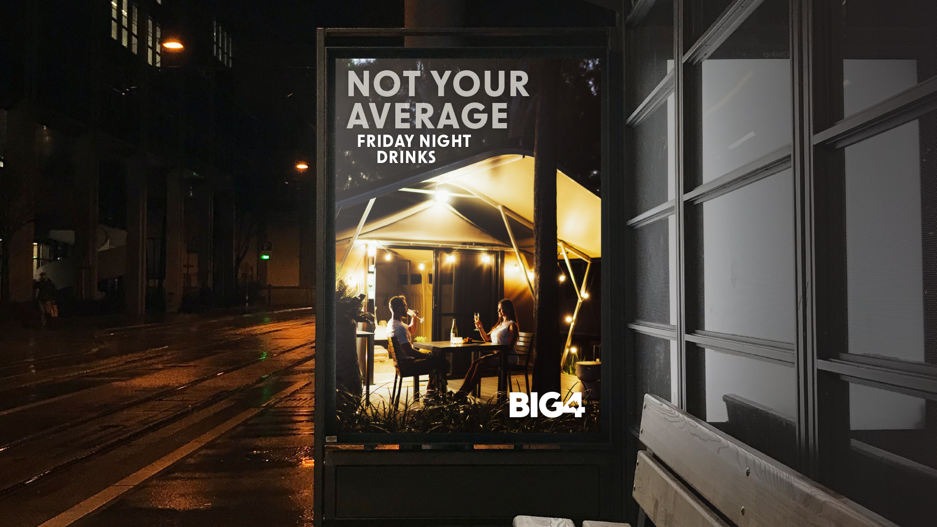 Work BIG4 new-8 A young man holding a takeaway coffee cup walks past a poster at an outdoor train station. The poster depicts a young couple enjoying coffee outside a wooden cabin, with the tagline '152km From Your Regular Coffee Spot'. Part of Big 4's 'Experience More' campaign by Bellwether Agency, 2022